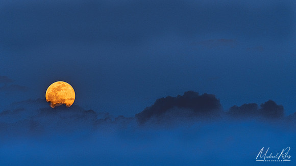 Pink Full Moon Rising Through Clouds (2020)